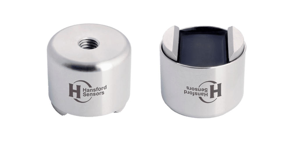 Two cylindrical Hansford Sensors metal units